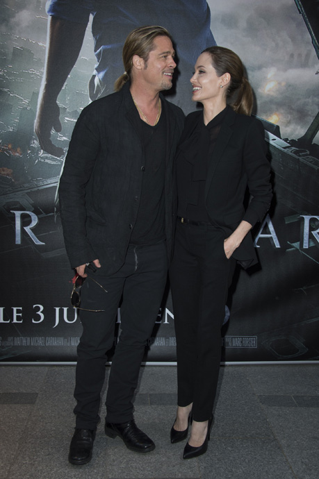 World War Z - Paris Premiere - Red Carpet Arrivals - PARIS, FRANCE - JUNE 03:  Brad Pitt and Angelina Jolie pose as they arrive for the Paris premiere of "World War Z" at Cinema UGC Normandie on June 3, 2013 in Paris, France.  (Photo by Pascal Le Segretain/Getty Images For Paramount)