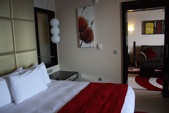 Bedroom of the honeymoon suite at Reef Oasis Blue Bay Resort and Spa