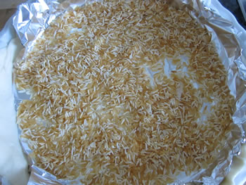 flaky dough with rice and aluminium foil 