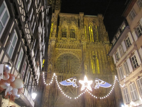 Cathedral of Strasbourg and old Alsatian houses by night