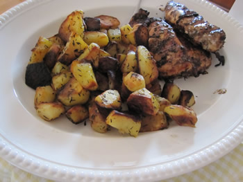 Grilled chicken with a side of potatoes with thyme