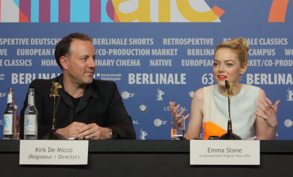 Emma Stone and director Kirk de Micco at the Berlinale, presenting The Croods