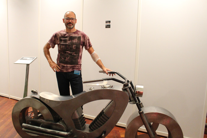 Eric Faure with his bike at Art International - credit photo Veronique Gray