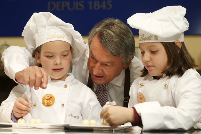 Ernst Tanner with the children making Lindt chocolates in Kilchberg headquarters - credit Photopress Alexandra Wey