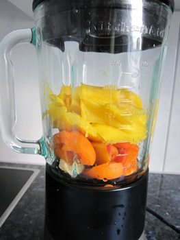 Mango, apricot, banana and peach in a blender