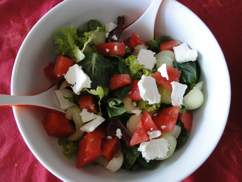 Watermelon with green leaves and feta cheese