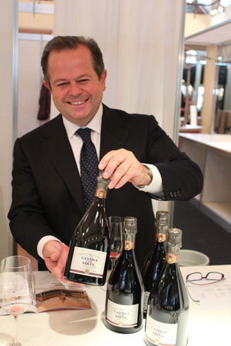 Giorgio Angiolini showing a bottle of Lambrusco wine, Cantina della Volta 2009