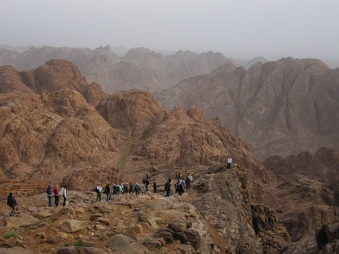 People leaving the top of Mount Sinai early in the morning