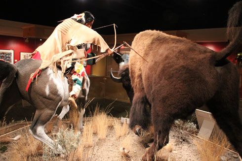 Indian killing a bison at the Bison Exhibit in Great Falls C.M. Russell Museum