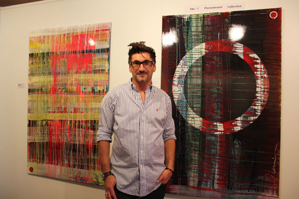 Joachim Oettli with his "O" Phenomenon paintings at Art International in Zurich