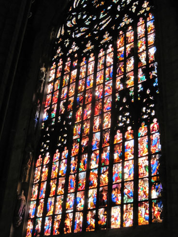 Large stain glass windows in the left transept