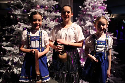 Little girls with traditional Swiss costumes and bells at Swiss Christmas