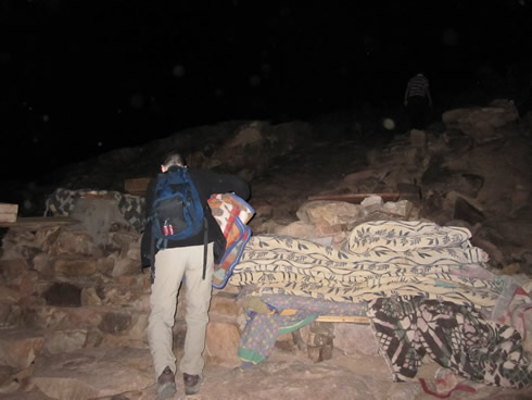 Carrying necessary blankets to the top of Mount Sinai
