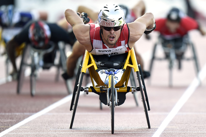 Marcel Hug from Switzerland competes in the men's wheelchair 1'500m event at the Athletissima IAAF Diamond League athletics meeting in the Stade Olympique de la Pontaise in Lausanne, Switzerland, Thursday, July 3, 2014. (KEYSTONE/Jean-Christophe Bott)