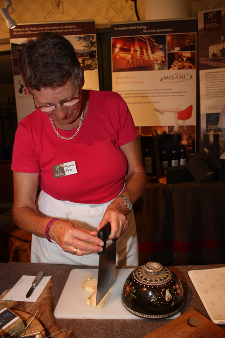 Mrs Hess cutting goat cheese from La Rosa near St Moritz copyright Véronique Gray