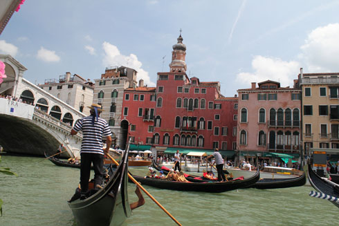 Rialto bridge and gondoles on Grand Canal in Venice