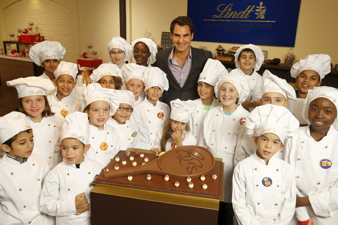 Roger Federer at Lindt in Kilchberg with children from Winterhilfe program - credit Photopress/ Alexandra Wey