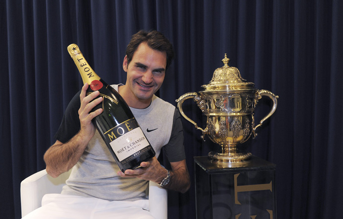 Roger Federer holds a bottle of Moet Chandon after his victory at the Swiss Indoors - copyright Moet & Chandon and Roger Federer in Basel - copyright Kurt Schorrer