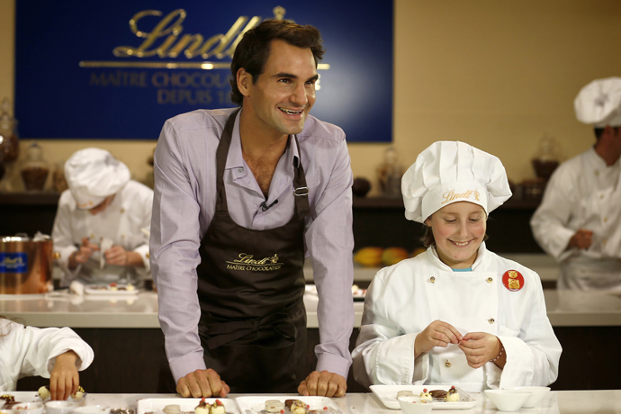 Roger Federer with the children of the Winterhilfe support program at the Kilchberg chocolateria credit Photopress Alexandra Wey