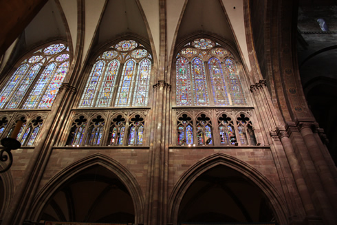 Triforium, vaults and stain glass windows of a Gothic cathedral