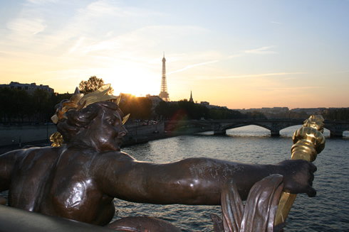Parisian sunset from Alexander III bridge with Eiffel Tower