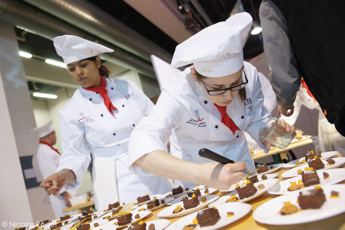 The BHMS students  help prepare the Macadamia bars at the Salon du Chocolat in Zurich - credit Nicolas Rodet