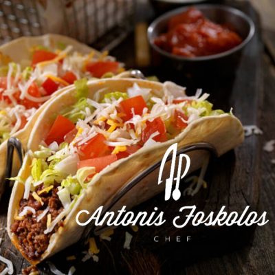 Tortillas rolls with chili con carne and salsa dip