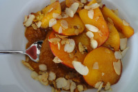 Sautéed peach on an apricot compote with roasted almonds (Serving: 1)